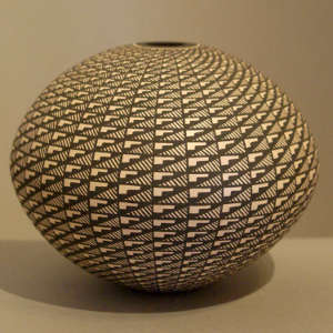Geometric design on a black and white seed pot