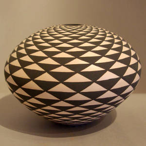 Geometric design on a black and white seed pot