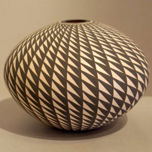 Geometric design on a black and white seed pot