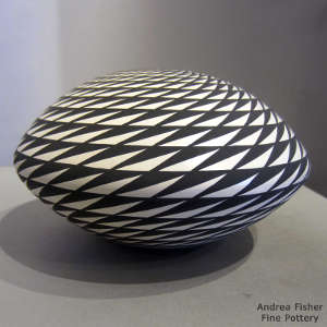 Geometric design on a black and white seed pot