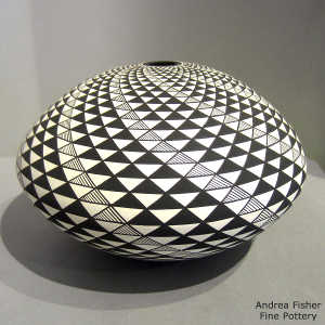 Step swirl geometric design on a black and white seed pot