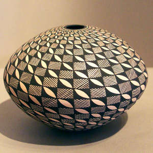 Fine line and geometric design on a black and white seed pot