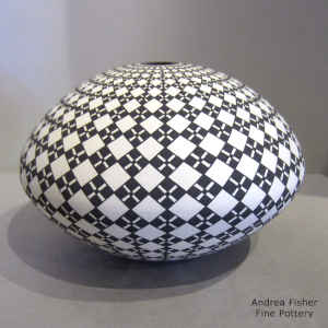Geometric design on a black and white seed pot