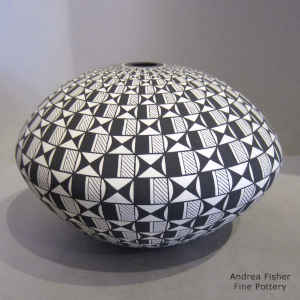 Geometric design on a black and white seed pot