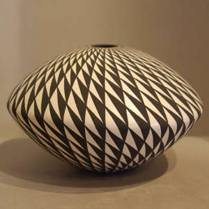 Geometric design on a black and white seed pot