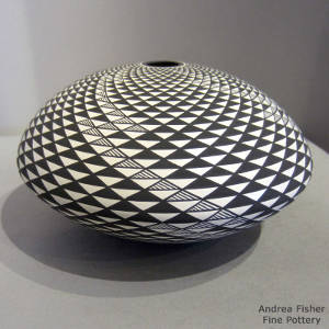 Step and swirl design on a black and white seed pot