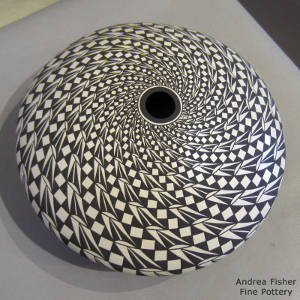 Geometric design on a black and white seed pot