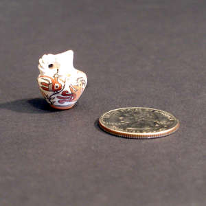 Mimiature polychrome parrot pitcher