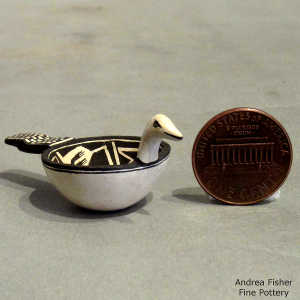 Bird and geometric design on a miniature black and white bird bowl