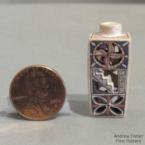 Geometric design on a square carved miniature jar