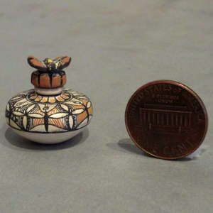 Butterfly design on a polychrome lidded jar