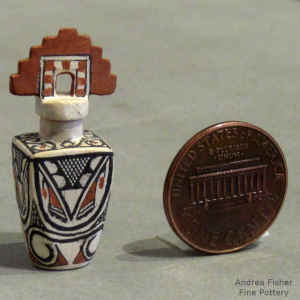 Fine line and geometric design on a miniature square polychrome jar with a tablita lid