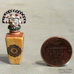 Fine line and geometric design on a miniature square polychrome jar with a tablita lid