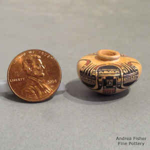 Bird element and geometric design on a miniature polychrome flat-top jar