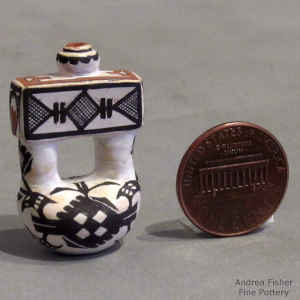 A geometric design on a miniature old-style Laguna canteen