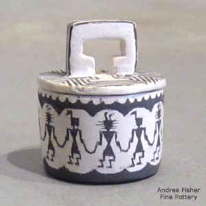 A band of warriors and geometric design on a miniature lidded black and white jar