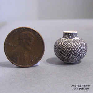 Locks and keys design on a miniature black and white jar