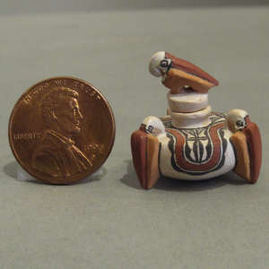 Parrot design on a miniature polychrome lidded jar