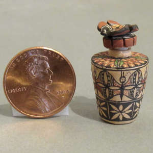 Butterfly and geometric design on a miniature lidded jar