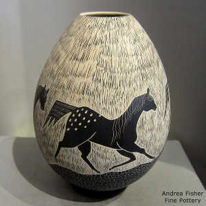 Sgraffito horse motif on a black and white jar