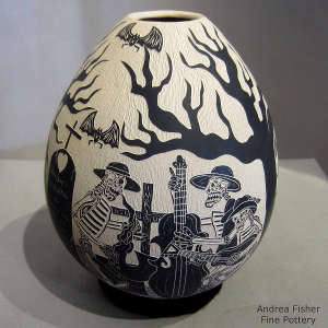Sgraffito Day of the Dead motif on a black and white jar