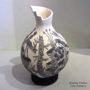 Black and white vase with a sgraffito nature and desert wildlife motif
