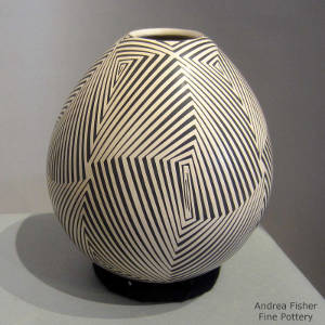 Geometric design decorating a black and tan jar