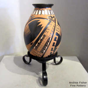 Geometric design on a polychrome vase with a custom stand