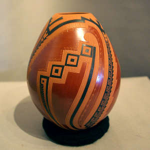 Sgraffito and painted geometric design on a polychrome jar