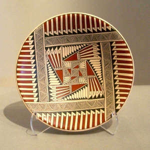 Fine line, feather and geometric designs on a polychrome plate