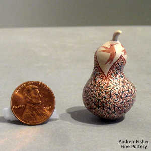 Hummingbird and geometric design on a miniature quail effigy jar