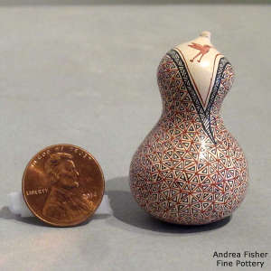 Hummingbird and geometric design on a miniature sculptured jar