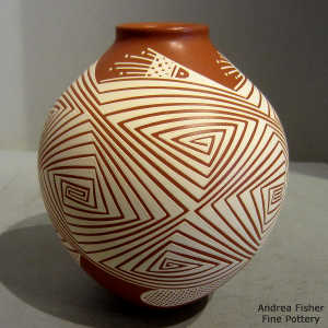 White geometric design on a red jar