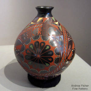 Animal elements in a geometric design on a polychrome jar
