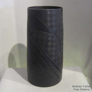 Click for a larger version Lightly carved, sgraffito and painted geometric design on a black on black on black cylinder