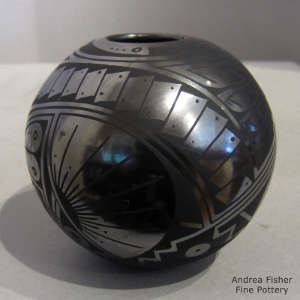 Geometric design on a black on black jar