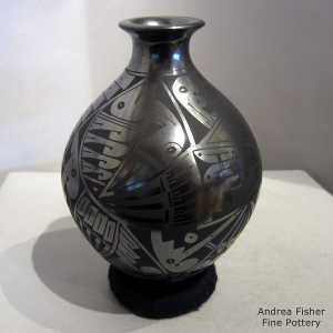 Bird element and geometric design on a black on black jar