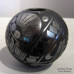 Geometric design on a black on black jar