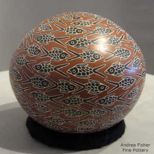 Sgraffito and painted fish design on a polychrome seed pot