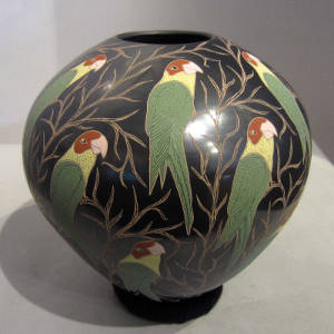 Sgraffito and painted parrot and branch design on a polychrome jar