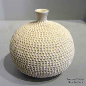 White jar with a corrugated surface and thin neck