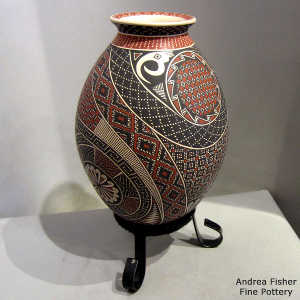 Geometric design on a polychrome jar with a custom stand