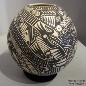 Serpent and other Paquime Revival creatures in a geometric matrix on a black-on-beige jar