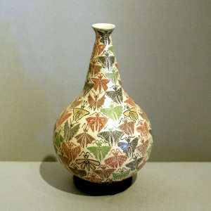 Butterfly design on a long neck polychrome jar
