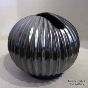 An organic opening on a black melon jar