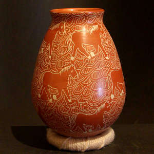 Sgraffito horse and geometric design on a red jar