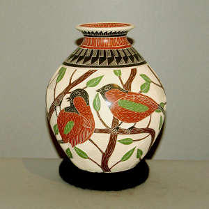 Sgraffito and painted bird, branch and geometric design on a polychrome jar