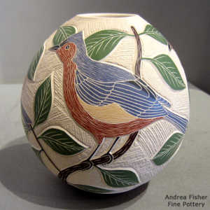 Sgraffito and painted bird, leaf, branch and geometric design on a polychrome jar