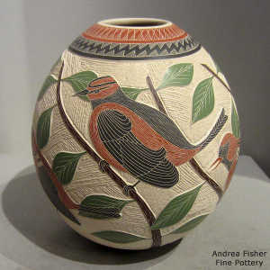 Sgraffito and painted bird, branch and geometric design on a polychrome jar