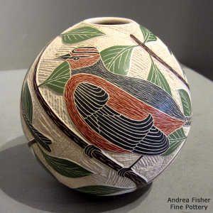 Sgraffito and painted branch, leaf, bird and geometric design on a polychrome jar